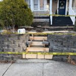 Existing steps showing wear and cracks before reconstruction. Masonry team preparing for complete replacement in Newton, NJ by Deluxe Construction.