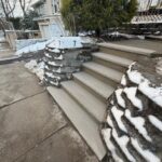 Step-by-step masonry work in progress in Newton, NJ. Foundation set, bricks laid, and mortar applied by Deluxe Construction for a long-lasting finish