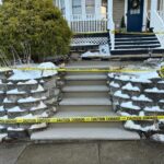 Existing steps showing wear and cracks before reconstruction. Masonry team preparing for complete replacement in Newton, NJ by Deluxe Construction.
